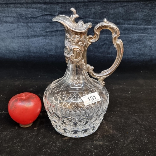 131 - A gorgeous mid 20th century Portuguese crystal carafe with a silver spout and handle featuring a Por... 