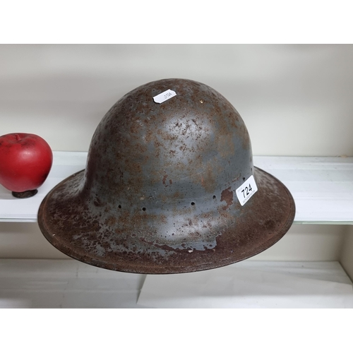 724 - A nice example of a WWII high dome  Zuckerman helmet, stamped M on the rim.