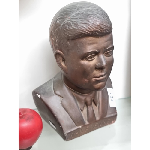 734 - A heavy stone bust of former American president John F Kennedy.