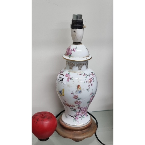 735 - A very pretty hand painted porcelain desk lamp boasting beautiful floral and butterfly motifs throug... 