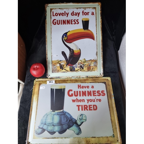 736 - Two nicely sized metal Guinness advertising wall signs.