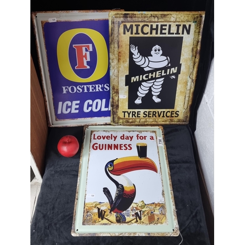 738 - Two large metal advertising wall signs for Fosters and Guinness.