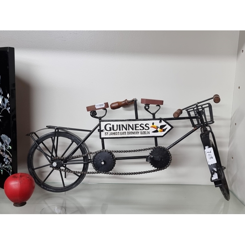 745 - A fabulous example of a cast metal Guinness advertising tandem bicycle. SD to one pedal.