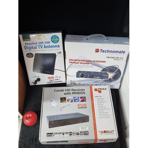 748 - Three items including a digital TV antenna, a Techomate satellite receiver and a Triax Combi HD rece... 