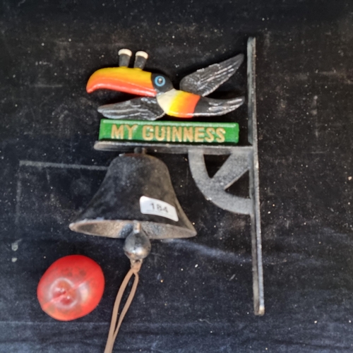 184 - An attractive cast metal Guinness advertising bell with a wall bracket.