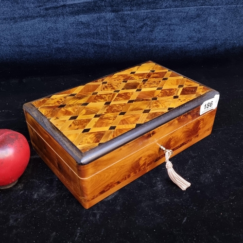 186 - Wonderfully crafted burr walnut jewellery box featuring exquisite marquetry to top.  With removable ... 