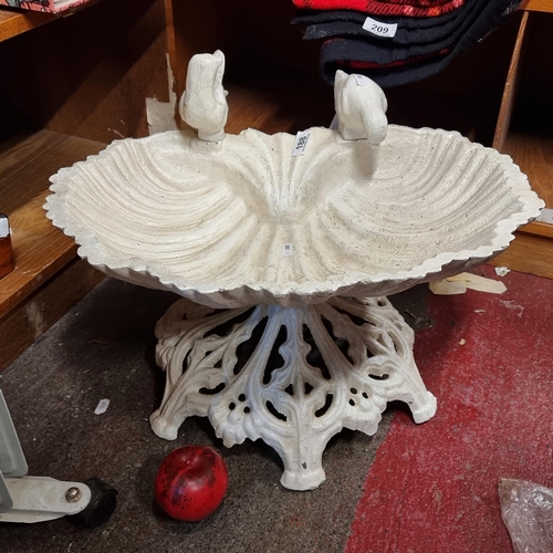 188 - Star Lot : An elegant very heavy cast iron bird bath with two doves atop of a shell shaped basin.