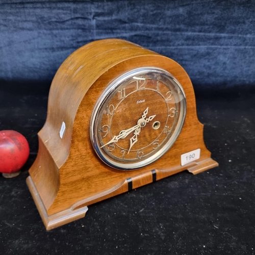 190 - A very handsome art deco Enfield mantel clock with an elegant wooden case and pendulum.