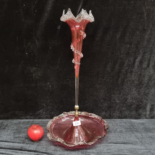 213 - A fabulous Victorian cranberry glass epergne with central trumpet spill boasting wavy edge clear gla... 