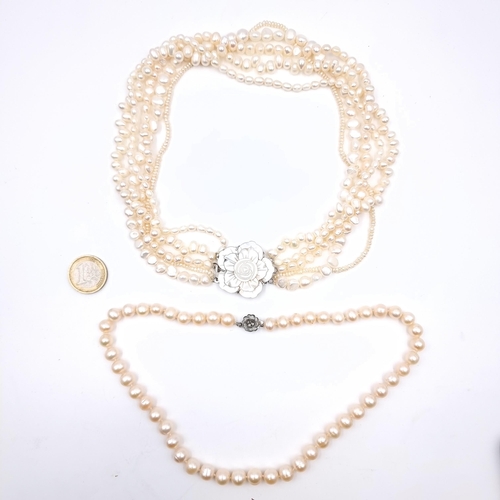 436 - Two natural pearl necklaces, the first a single strand example set with marcasite clasp together wit... 