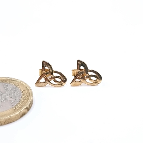 438 - A pair of Celtic design 9t gold stud earrings.