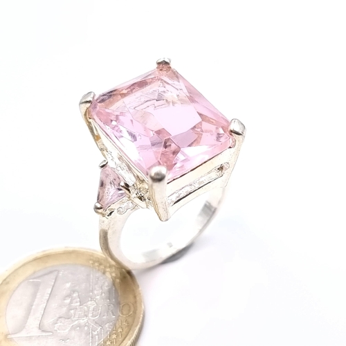 451 - A sterling silver huge pink gemstone ring, ring size P, weight 9.58 grams, boxed.