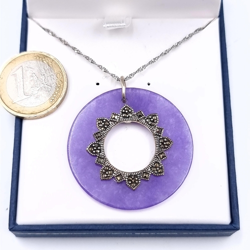 457 - A purple jade marcasite set pendant with silver chain, length of chain 40cm, total weight 10.5 grams... 