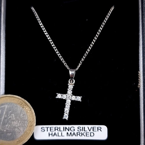 460 - A sterling silver cross pendant set with gem stone inlay, boxed.