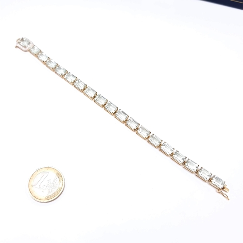 492 - Star Lot : A fabulous 9K gold Aqua Marie bracelet, clasp set with diamond surround. T otal weight 11... 