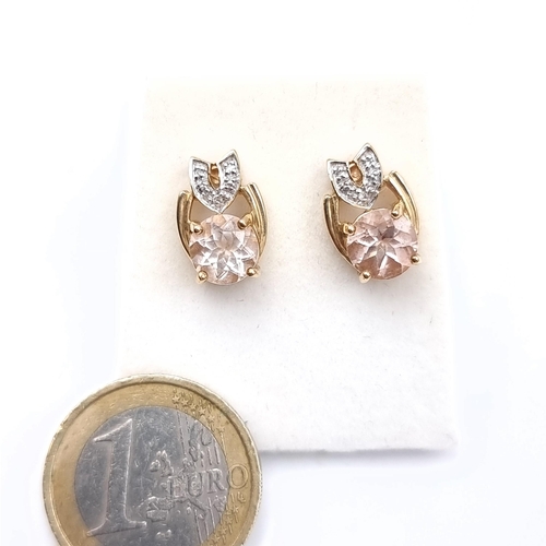 493 - A pair of 9K gold tourmaline stone set stud earrings with diamond mount accents, total weight 3.46 g... 