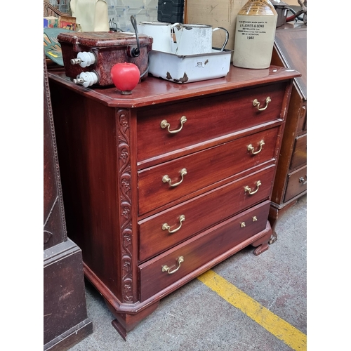 573 - An elegant dresser with four full-length drawers featuring brass swan neck handles. SD to drawer.