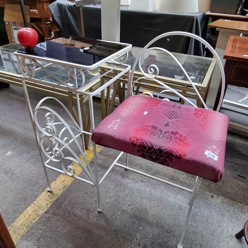 579 - A gorgeous cast metal hall telephone table featuring glass top table and upholstered seat.