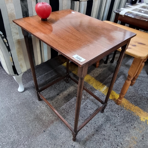 580 - A charming Mid Century mahogany side table.