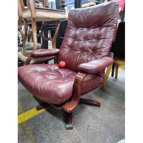 585 - Star Lot : A beautiful vintage Danish armchair by Daneware, after De Sede. Upholstered in deep red l... 