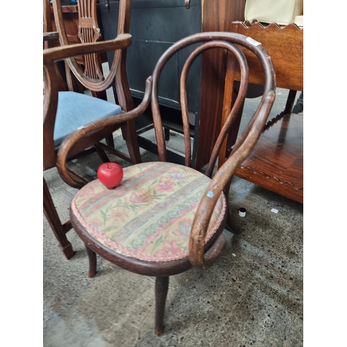 598 - A gorgeous antique bentwood armchair upholstered with a fabulous floral patterned seat. Fabulous cur... 