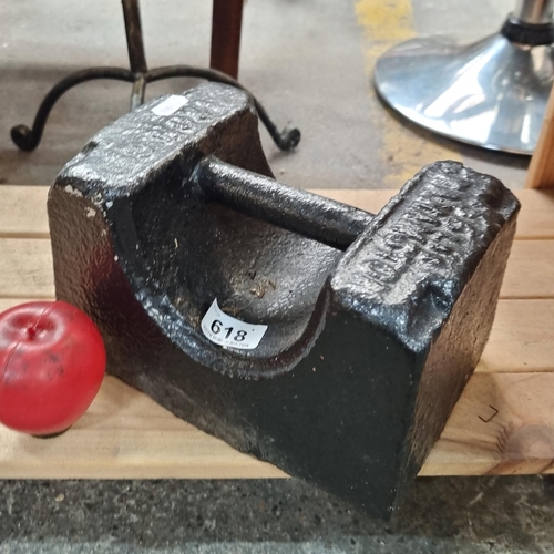 618 - A unique cast iron weight weighing 56lbs.