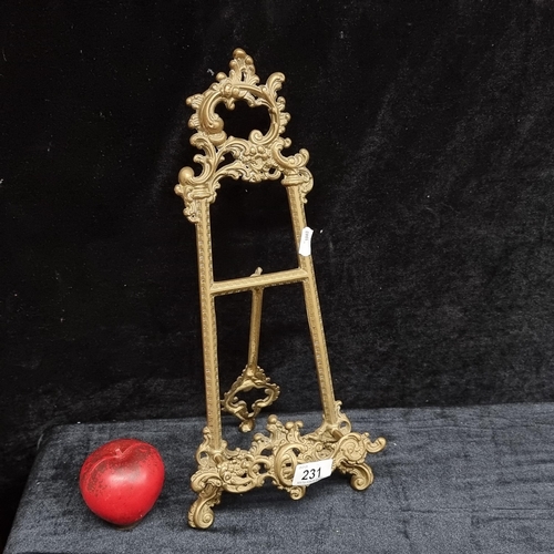 231 - A beautiful ornate Rococo style brass miniature easel. Great for displaying photographs