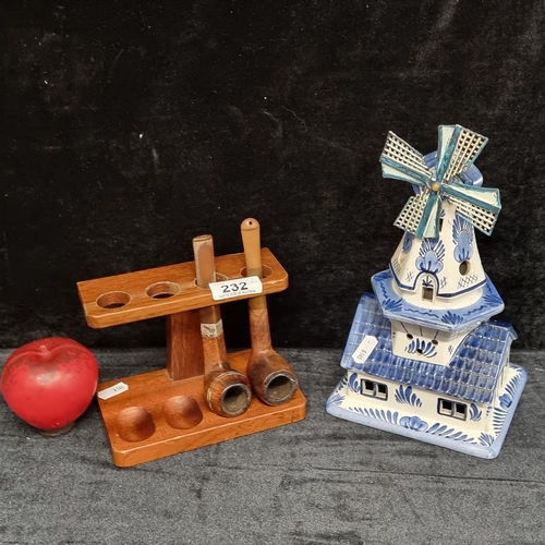 232 - Two items comprising of a charming Dutch made ceramic windmill and a wooden pipe stand with accompan... 