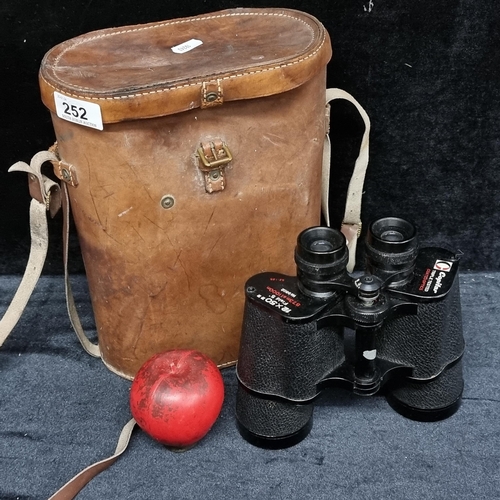 252 - A fantastic pair of Copitar 12x50mm field binoculars held in a smart hard shell brown leather travel... 