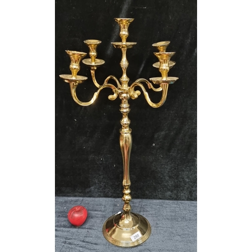 280 - A stunning tall candelabra with five branches with drip trays to each, boasting wonderful scroll and... 