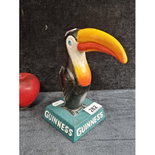 282 - A heavy cast metal desk figure of the Guinness Toucan.