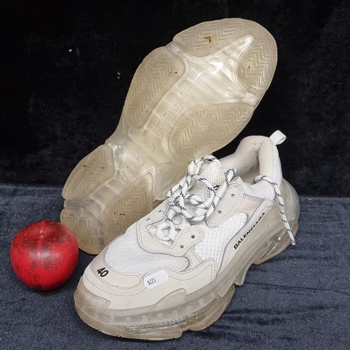 A pair of Balenciaga designer Triple S Trainers. In worn but good ...