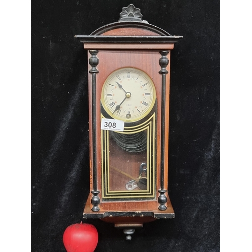 308 - A charming 31 day chiming wall clock in wooden case with black and gilt reverse painted glass front.