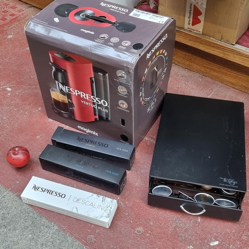 340 - A Nespresso Vertuo Plus coffee maker in original box. Accompanied by a coffee pod display  and a sel... 