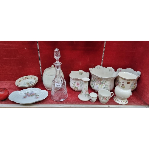 346 - A selection of  twelve items including planters, a vase, and an elegant crystal decanter. All in goo... 