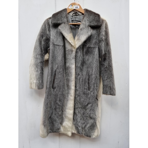 350 - Star Lot  : An unusual and stylish vintage fur coat in a black and white shade from Lichtblau. Appro... 