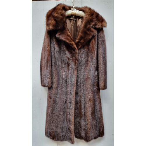 353 - Star Lot : A beautiful genuine mink fur coat. From Saga Mink. In very good condition. Approx size UK... 