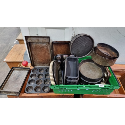 377 - A collection of approx. 40 metal baking trays.