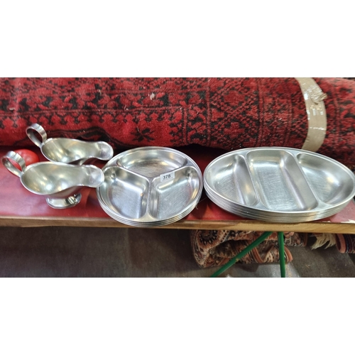 378 - A collection of 15 stainless steel food serving trays and gravy boats. Trays are heavy and good qual... 