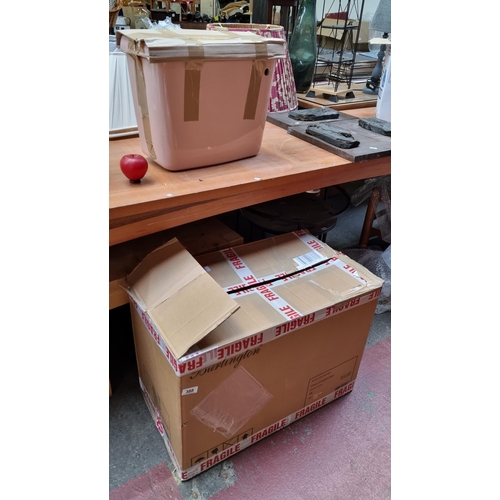 388 - A brand new pink ceramic toilet comprising of the bowl and water reservoir. (2 pieces brand new. )