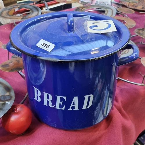 416 - A large vintage enamelled lidded bread bin in a blue finish.