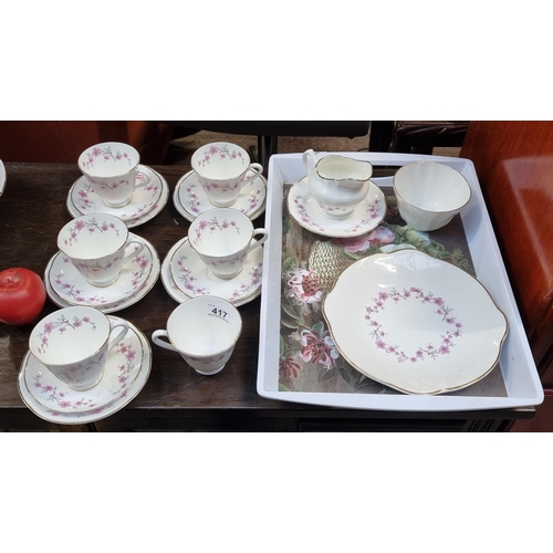 417 - Twenty pieces of Royal Tara Fine Bone China tea set featuring a delicate cherry blossom design. In v... 