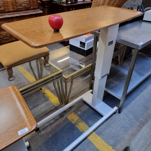 423 - A high quality hospital overbed table with adjustable height from Fannin Ireland. Held on castors. W... 