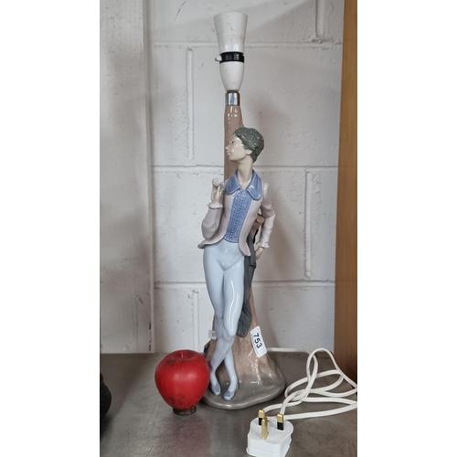 753 - A fabulous tall Spanish made Nao porcelain table lamp featuring a dandy chap. . In good condition