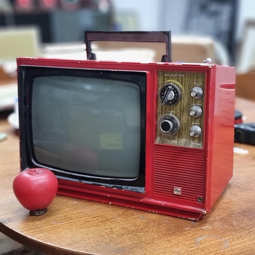 762 - A portable Mid Century Toshiba television model no. 11TBE. Circa 1968. In red. Great for room settin... 