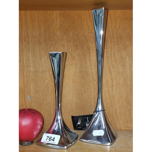 764 - A modern pair of Robert Welch stainless steel 'Vale' candle holders. New with tags With RRP of €66 e... 