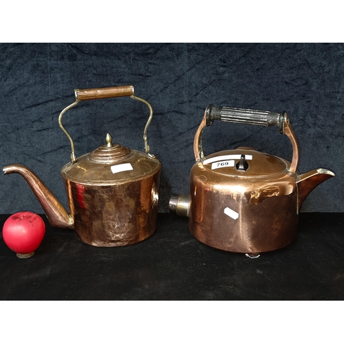 769 - Two wonderful early 20th century copper kettles including an Irish made example with a bakelite hand... 