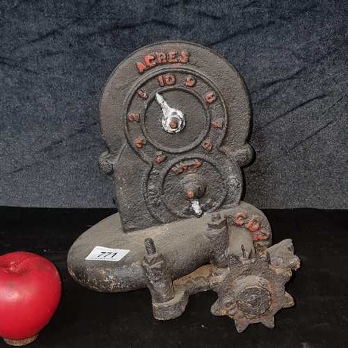 771 - An original antique cast iron agricultural machinery part with acre marker and cog.