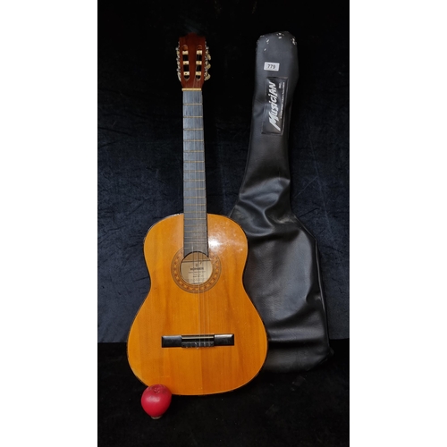 779 - A Hohner hand crafted acoustic guitar model MC-05 in brown and black finish. . Comes with a black Mu... 