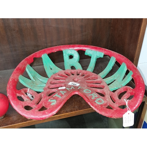 786 - An original antique cast iron Martin Stamford seat in shades of red and green. Great piece of agricu... 